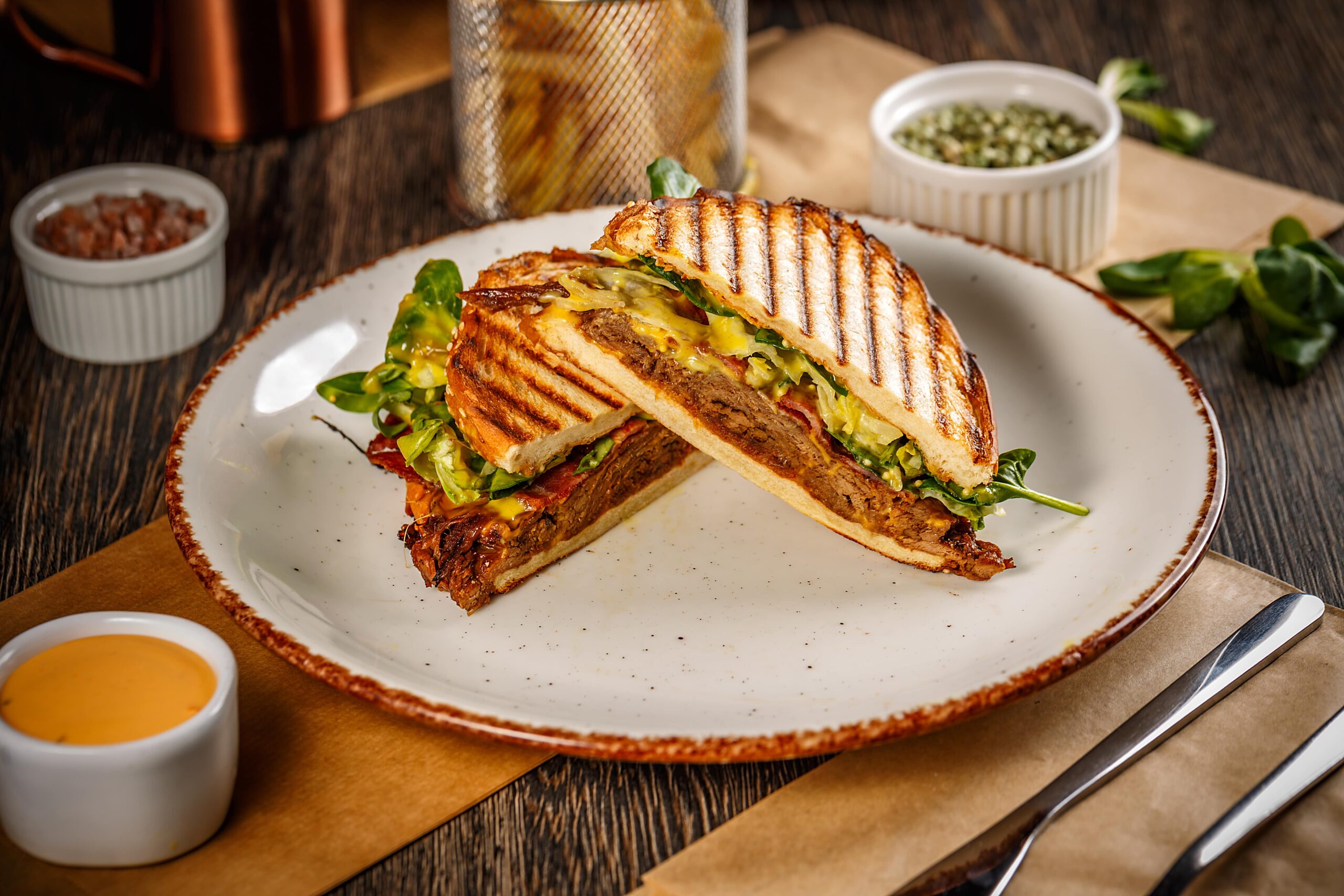 Grilled Indian street food sandwich with fries at Blossom Chai Cafe.